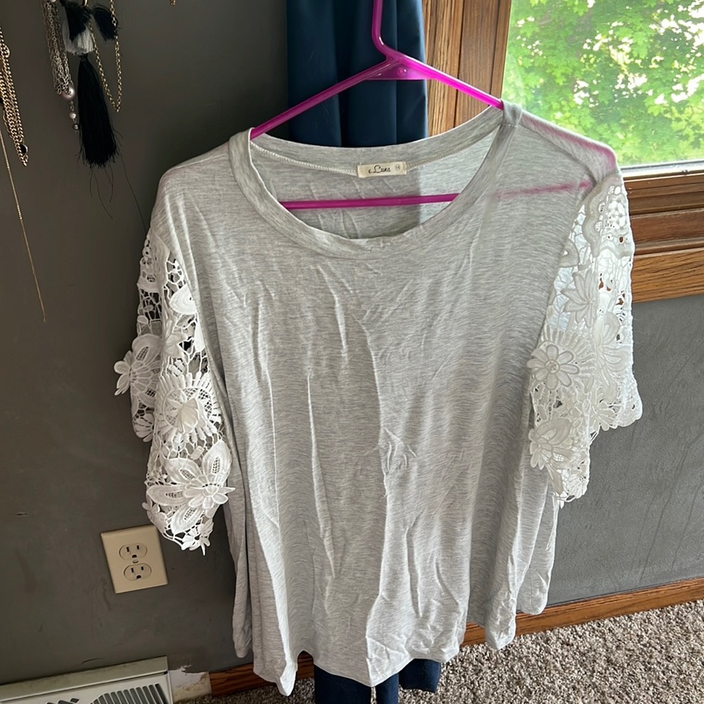 1X see through lace sleeved top. Only worn once